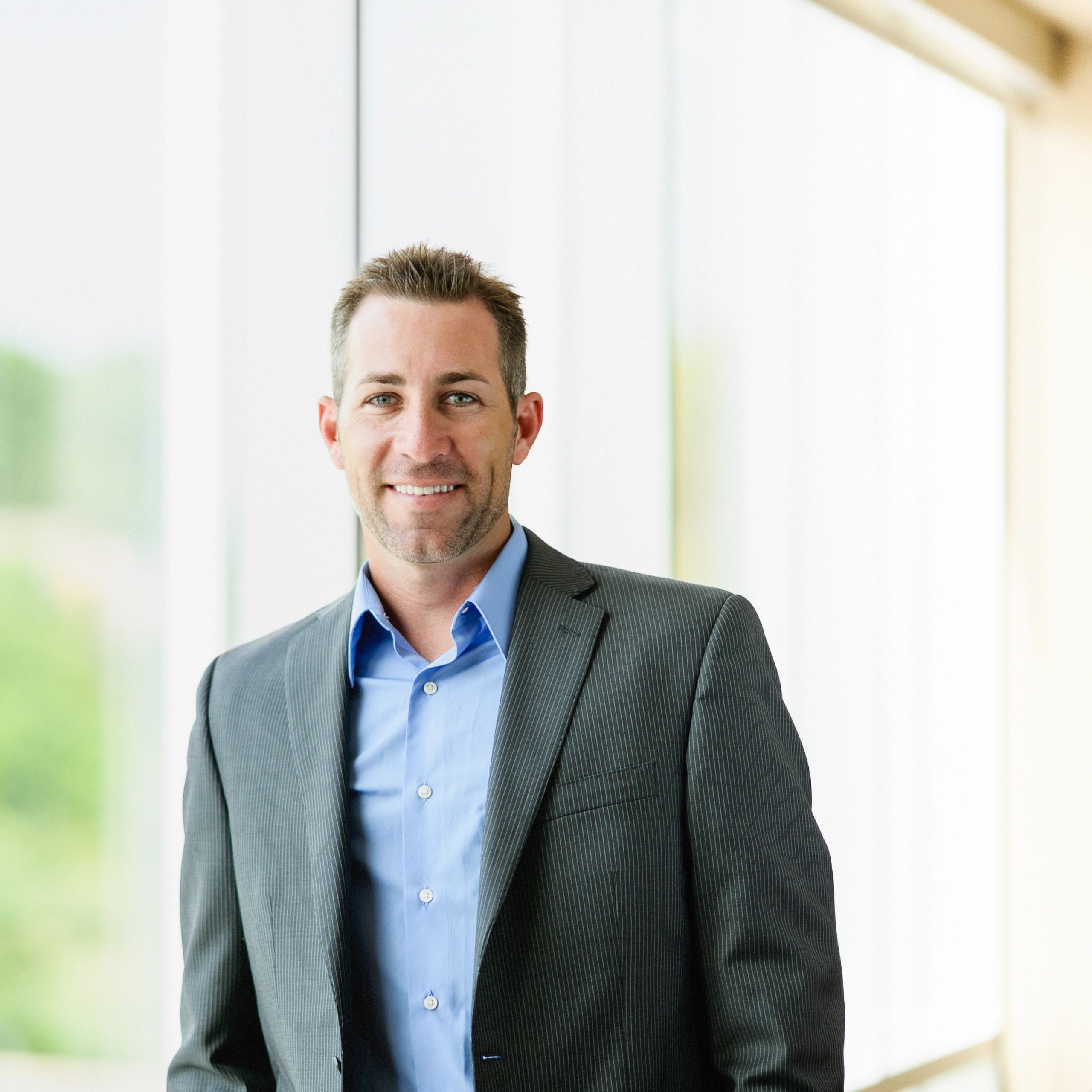 Professional portrait representing Fastline Logistics delivery manager