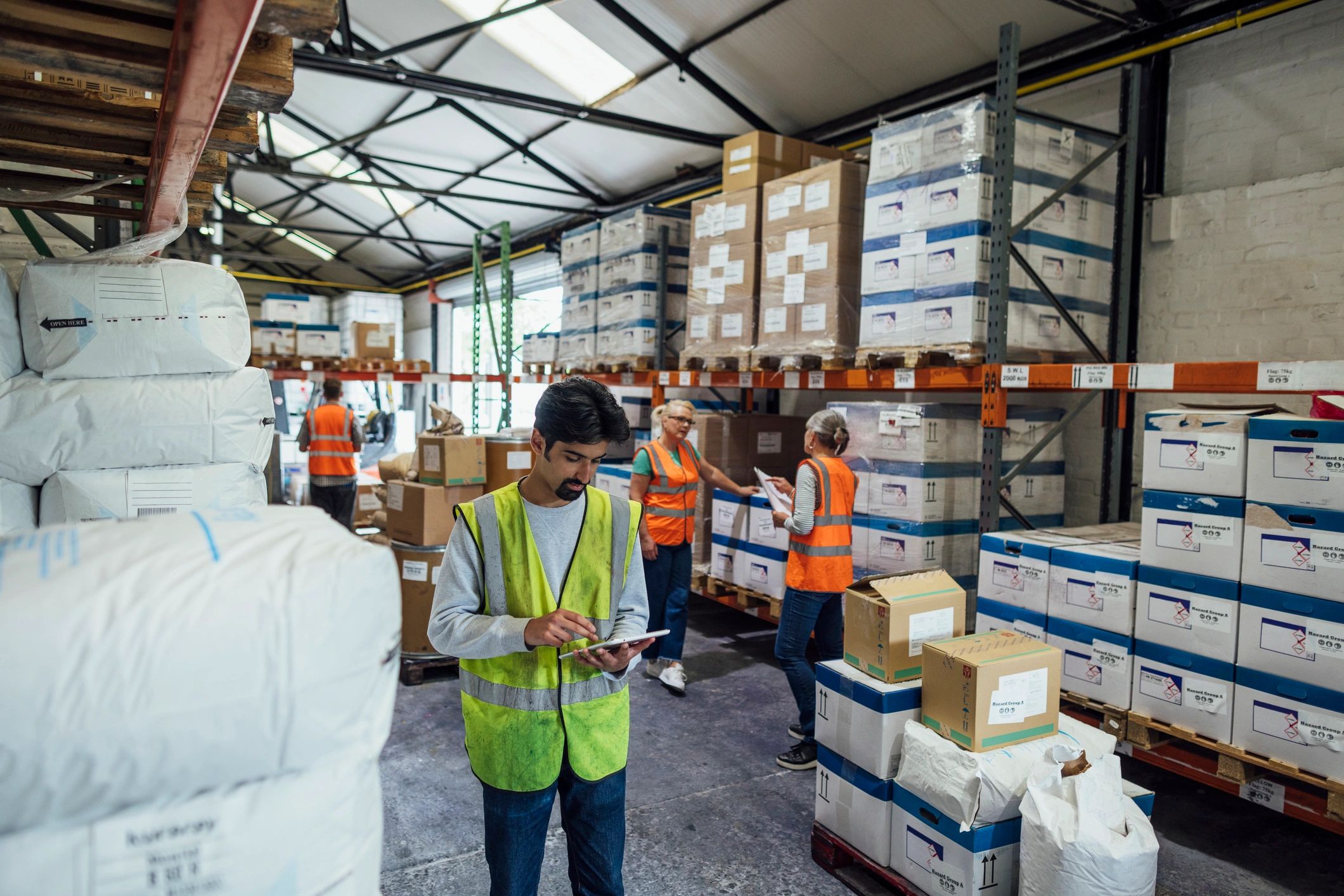 Warehouse operations staff using digital tools