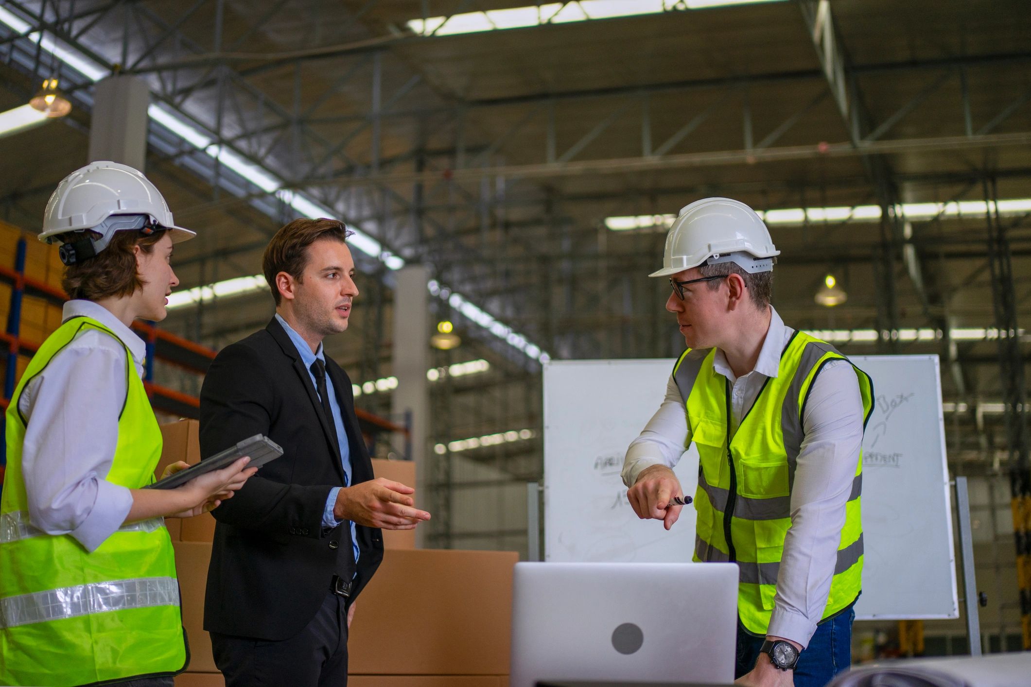 Logistics team meeting in a warehouse