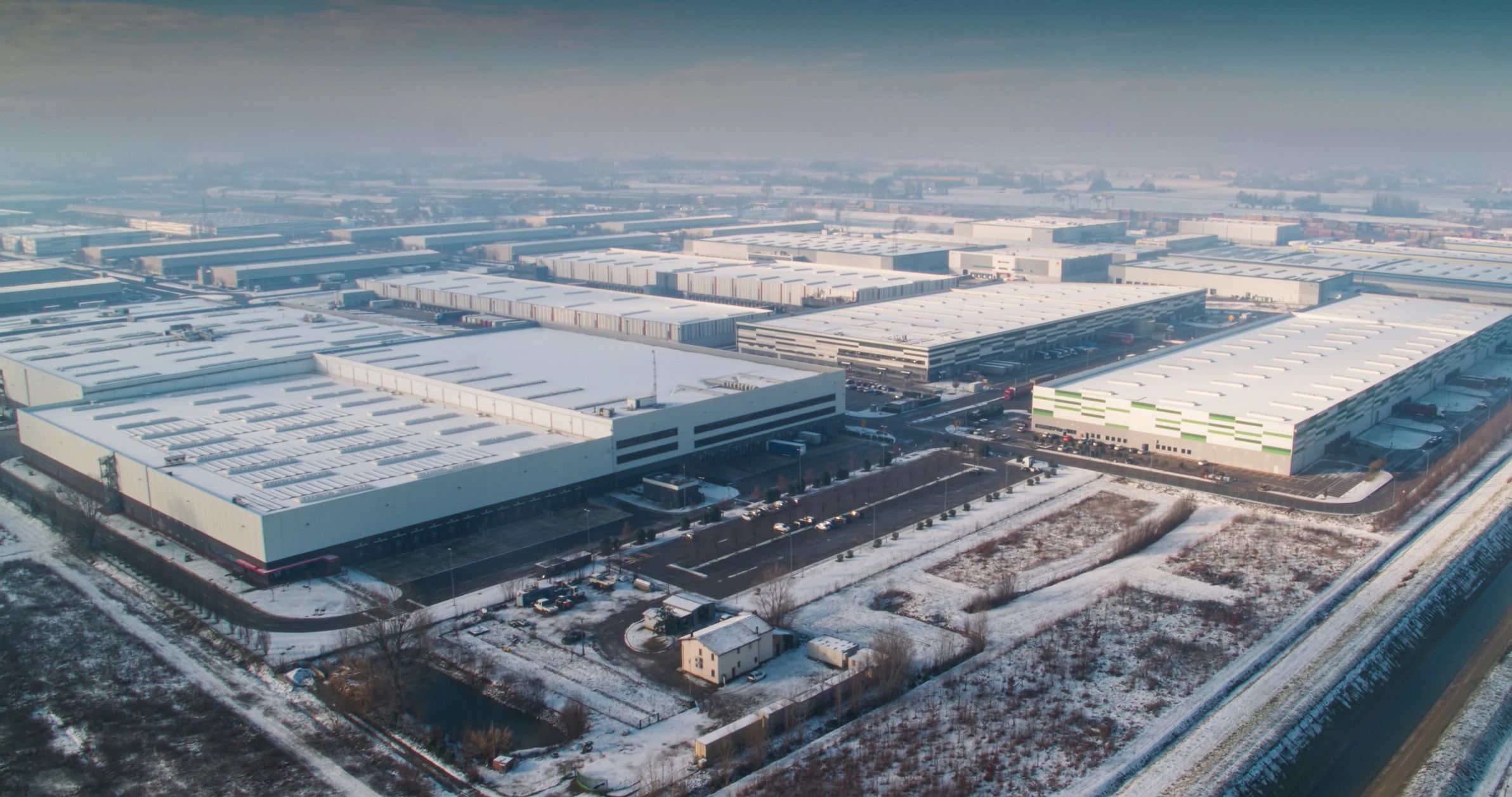 Aerial view of a major logistics hub with warehouses and transport infrastructure