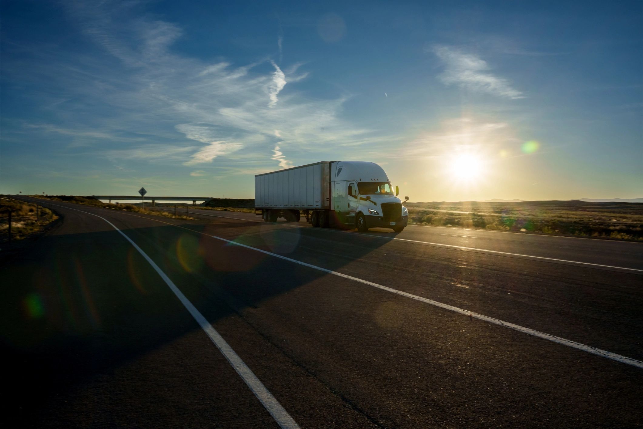 Logistics vehicle on the road representing fast nationwide delivery