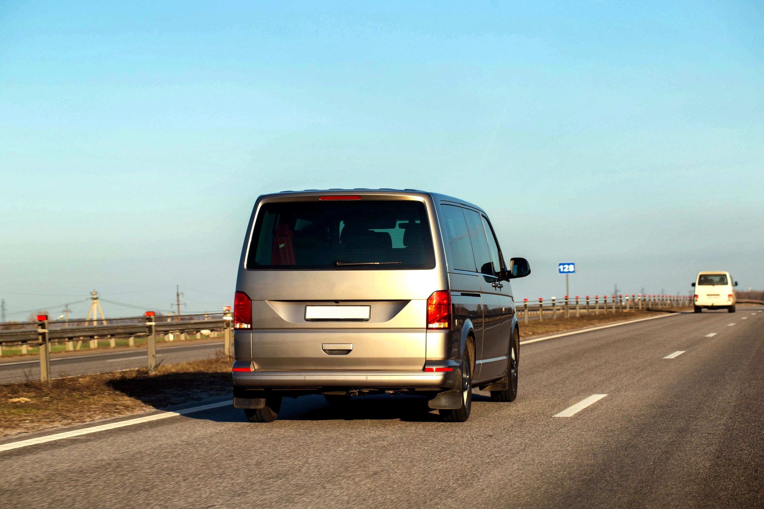 Delivery van travelling on a UK road for next day courier service